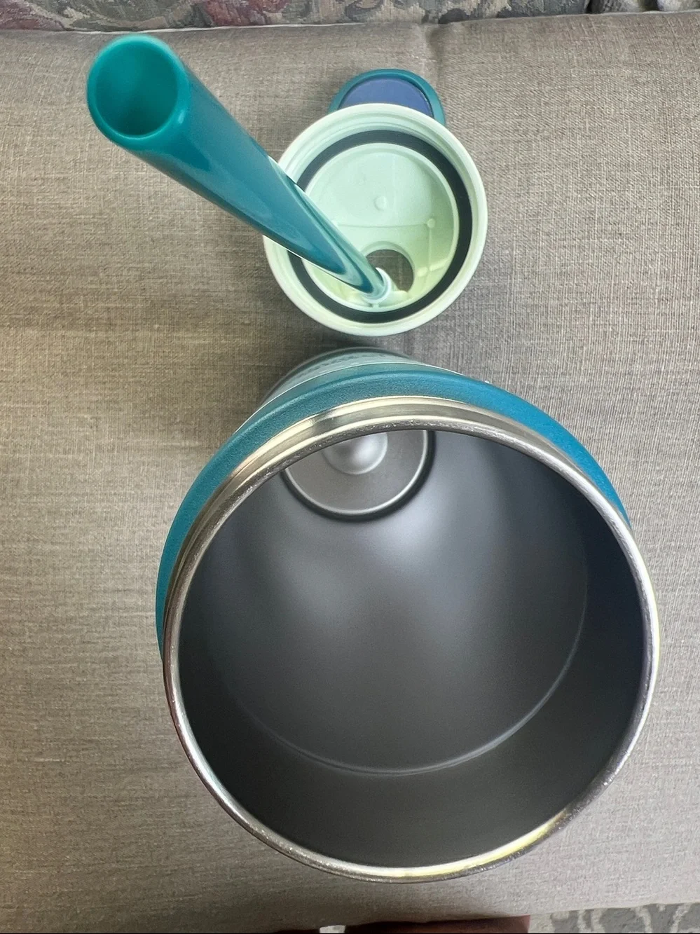 Owala FreeSip Stainless Steel Water Bottle in a 24 oz size blue & teal color